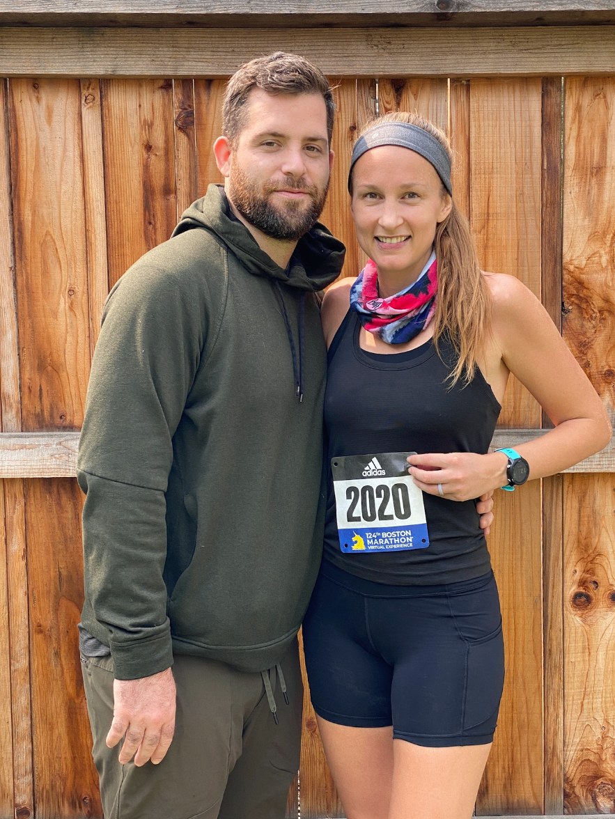 Laura with her 2020 Boston Marathon virtual bib, next to Nick